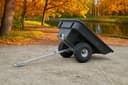 ATVCB ATV trailer black plastic tub, dual rear wheels, full three-quarter rear view with tow hitch