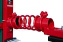 D-95 cattle oiler close-up of red coil spring arm assembly, front angle showing pipe clamp hardware