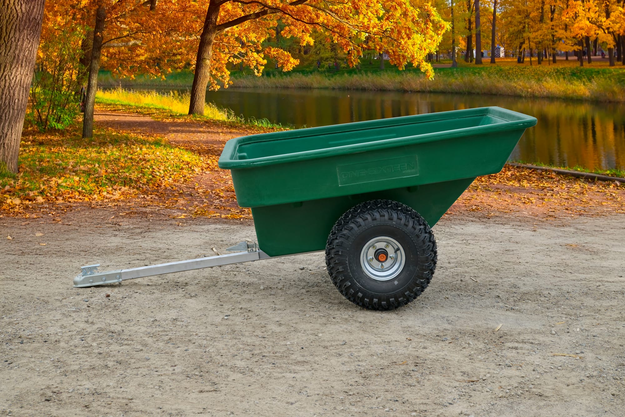ATVCG ATV trailer green plastic tub, single rear wheel, full left side view with tow hitch